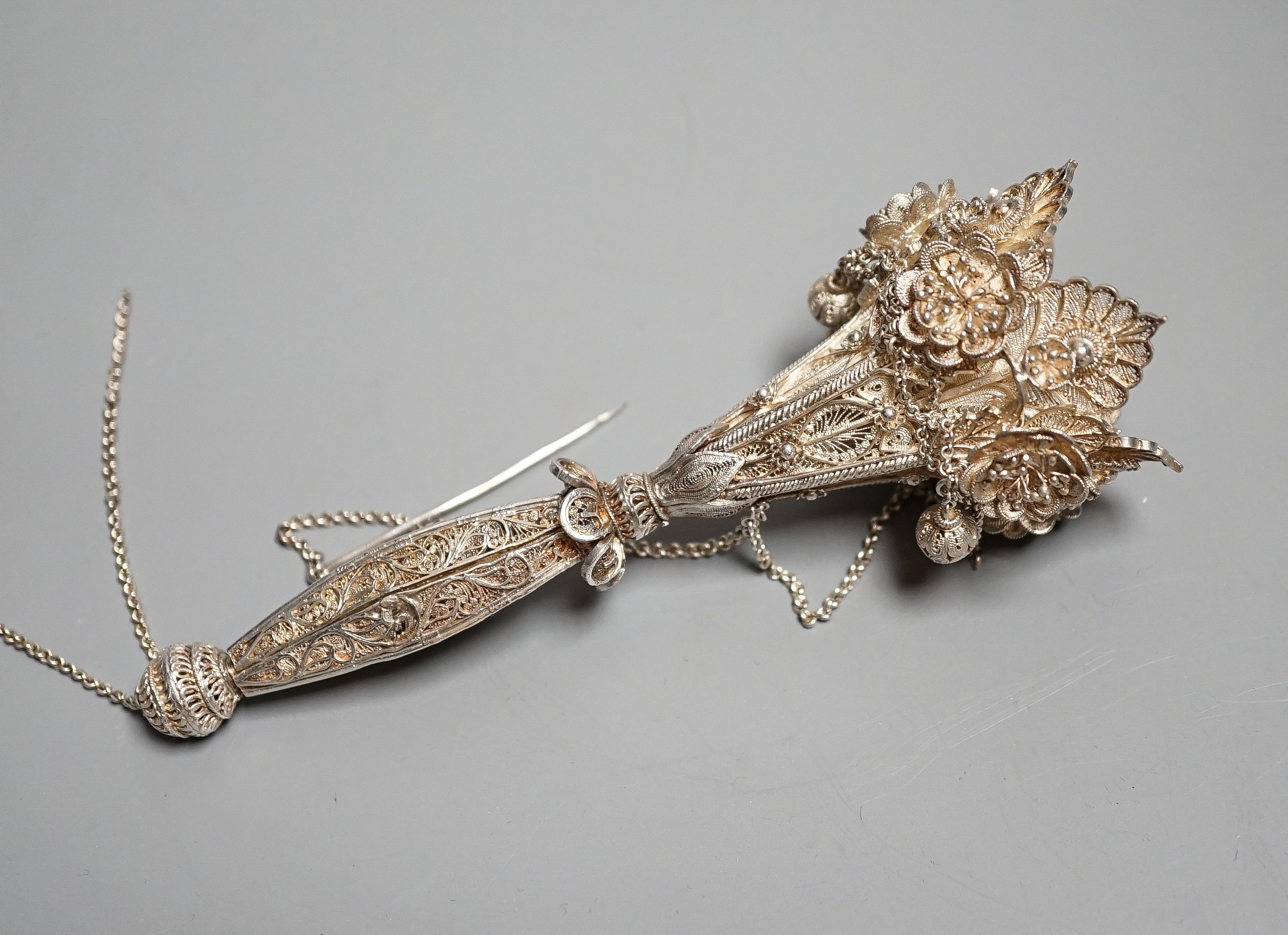 A late 19th century white metal filigree posy holder, 14.1cm. The ball at the base unscrewing to reveal three spring-loaded legs